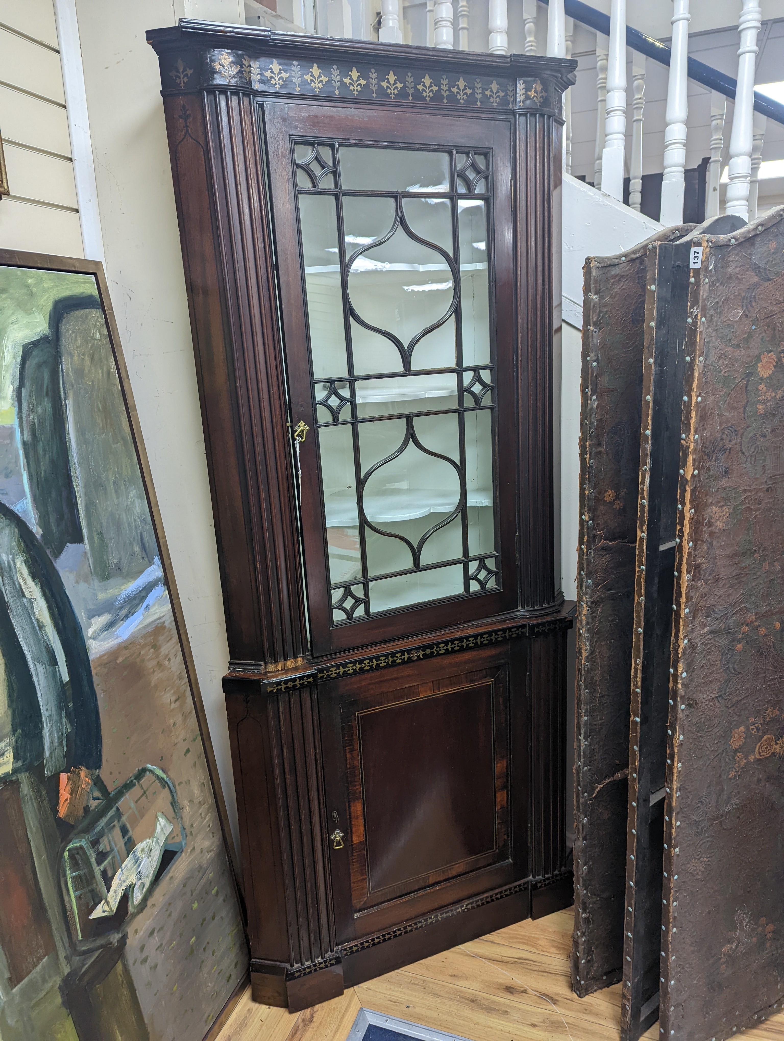 A Regency brass inlaid banded mahogany standing corner cabinet, width 96cm, depth 50cm, height 212cm